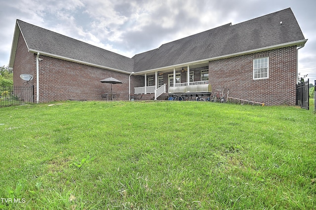 2041 King College Rd, Bristol, TN 37620 - back of house featuring brick siding, ceiling fan, covered porch, and roof with shingles
