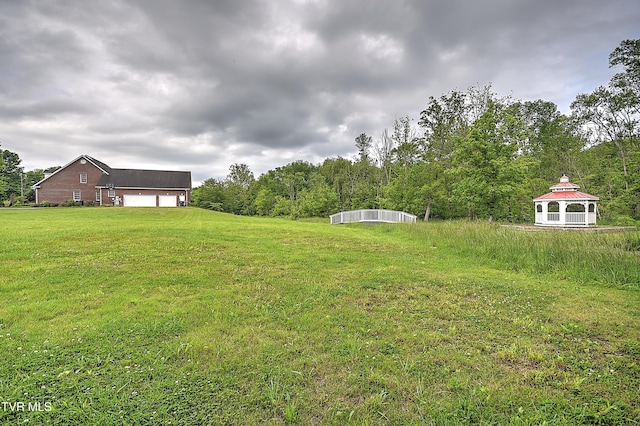 2041 King College Rd, Bristol, TN 37620 - view of grassy yard featuring an attached garage and a gazebo