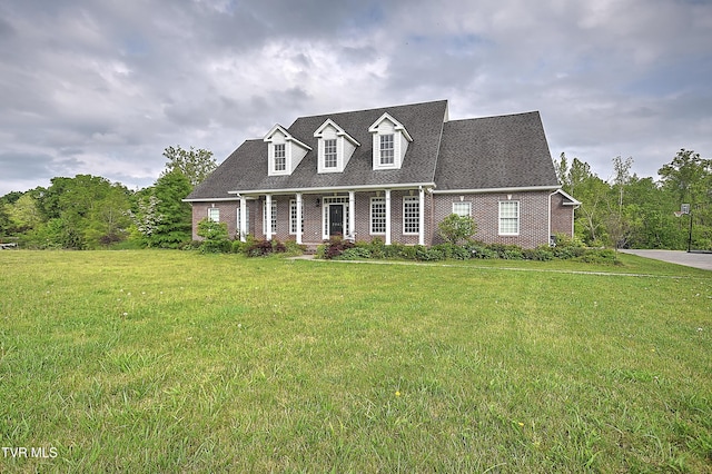 2041 King College Rd, Bristol, TN 37620 - cape cod house featuring brick siding, a front lawn, and a porch