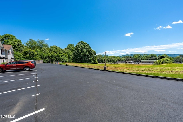 614 N Center St Unit 5, Johnson City, TN 37604 - view of asphalt street featuring a mountain view, street lights, and curbs