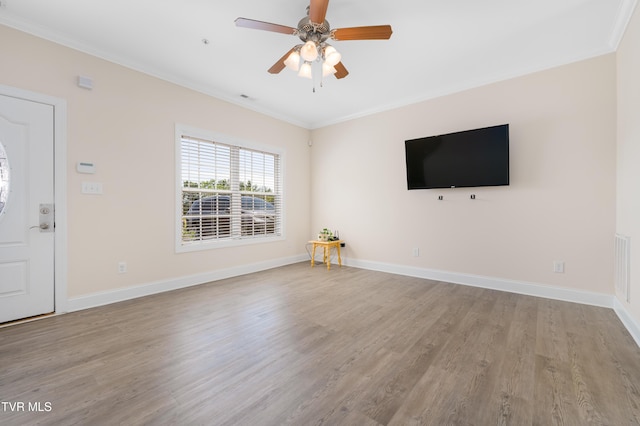 614 N Center St Unit 5, Johnson City, TN 37604 - unfurnished living room featuring crown molding, light wood-type flooring, baseboards, and a ceiling fan