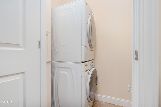 614 N Center St Unit 5, Johnson City, TN 37604 - laundry area featuring estacked washer and dryer, baseboards, and tile patterned floors