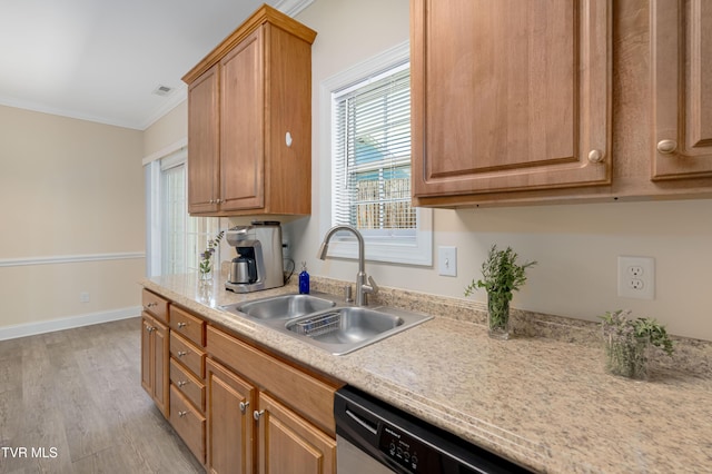 614 N Center St Unit 5, Johnson City, TN 37604 - kitchen featuring a sink, light countertops, crown molding, light wood-style flooring, and baseboards