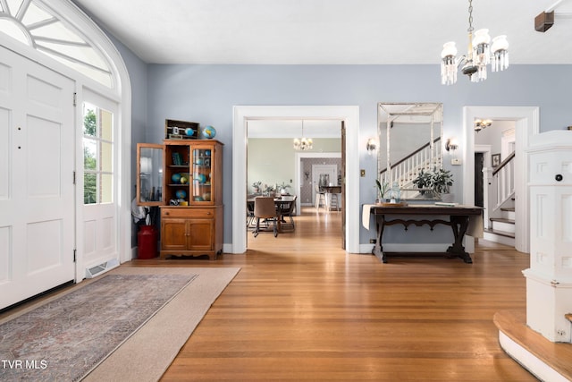 2107 Bartlett St, Johnson City, TN 37601 - entryway featuring a chandelier, stairway, and light wood-type flooring