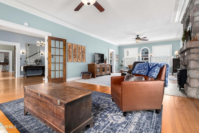 2107 Bartlett St, Johnson City, TN 37601 - living area featuring ceiling fan, crown molding, wood finished floors, stairs, and a chandelier