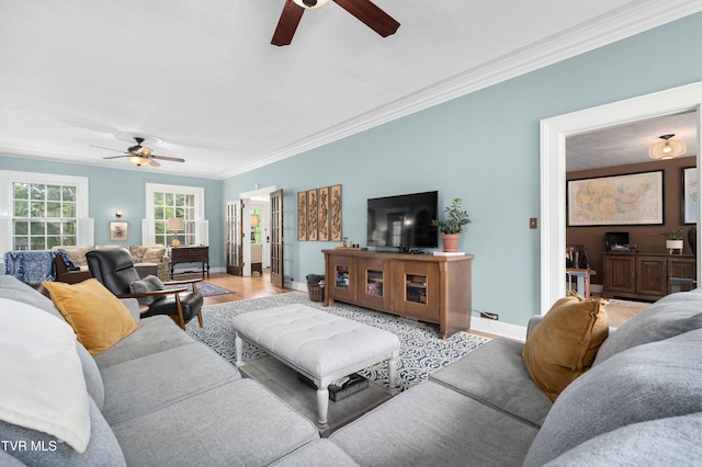 2107 Bartlett St, Johnson City, TN 37601 - living room with ceiling fan, ornamental molding, baseboards, and light wood-style floors