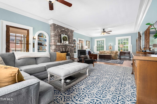 2107 Bartlett St, Johnson City, TN 37601 - living area featuring ceiling fan, ornamental molding, wood finished floors, and a stone fireplace