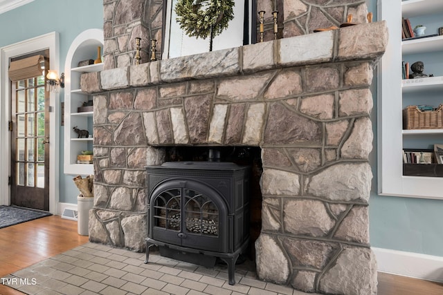 2107 Bartlett St, Johnson City, TN 37601 - detailed view of a wood stove, wood finished floors, and baseboards