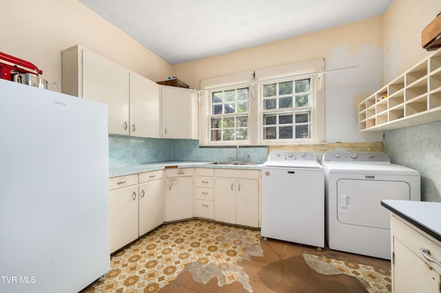 2107 Bartlett St, Johnson City, TN 37601 - washroom featuring cabinet space and washer and dryer