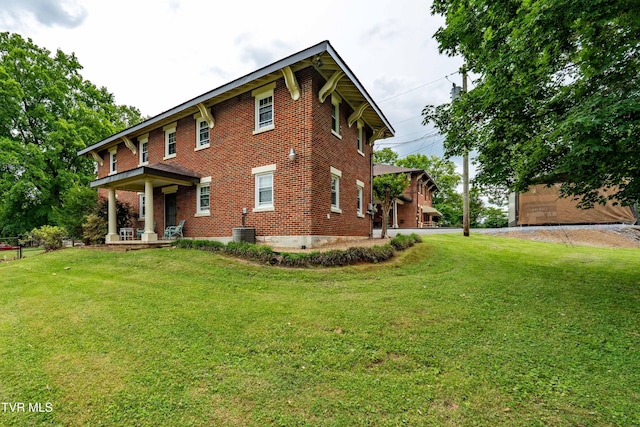 2107 Bartlett St, Johnson City, TN 37601 - view of front of home featuring a porch, brick siding, and a front lawn