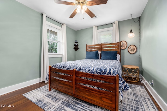 2107 Bartlett St, Johnson City, TN 37601 - bedroom with baseboards, wood finished floors, and a ceiling fan