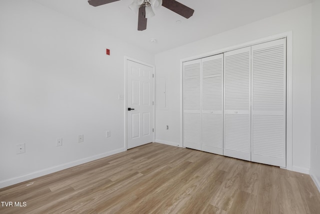 2008 Millennium Pl Unit 201, Johnson City, TN 37604 - unfurnished bedroom featuring light wood-style flooring, baseboards, a closet, and a ceiling fan