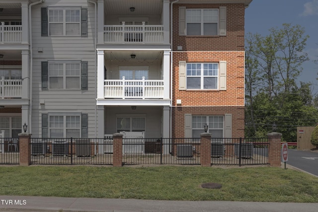 2008 Millennium Pl Unit 201, Johnson City, TN 37604 - view of front of home featuring brick siding, fence, and central AC unit