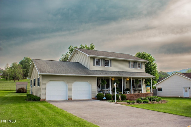 519 Foxgate Dr, Erwin, TN 37650 - traditional home with a porch, an attached garage, a front lawn, and asphalt driveway
