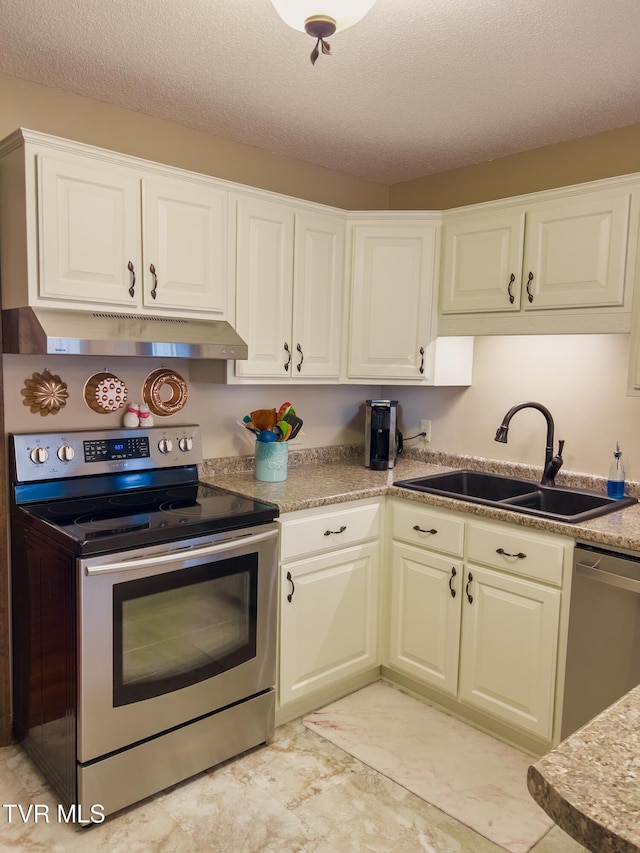 519 Foxgate Dr, Erwin, TN 37650 - kitchen with appliances with stainless steel finishes, a sink, under cabinet range hood, white cabinets, and light countertops