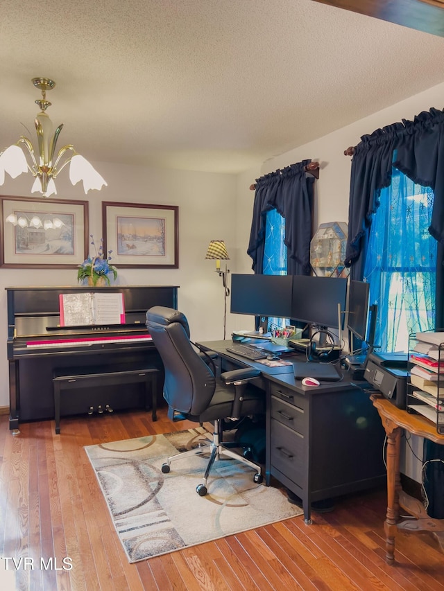 519 Foxgate Dr, Erwin, TN 37650 - home office featuring hardwood / wood-style flooring, a chandelier, and a textured ceiling