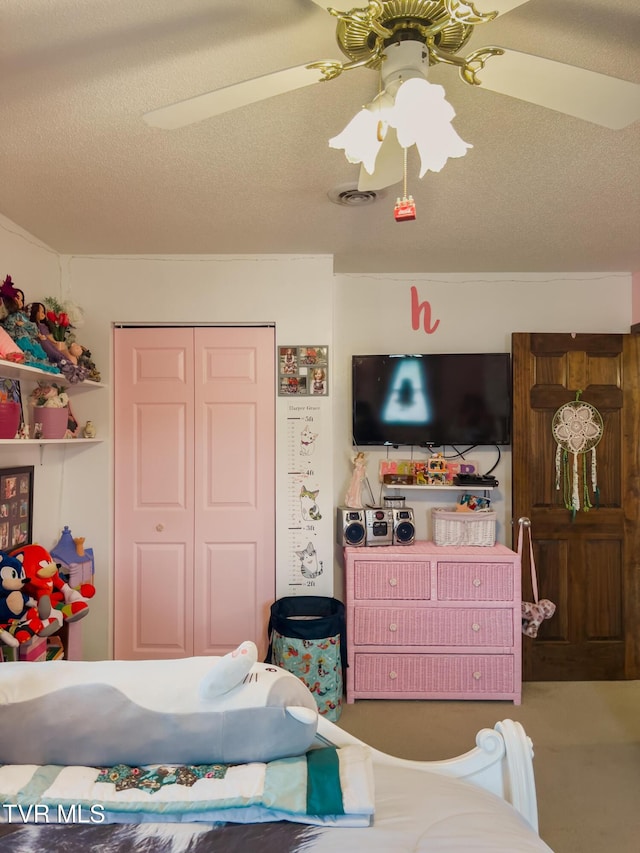 519 Foxgate Dr, Erwin, TN 37650 - bedroom featuring a closet, ceiling fan, and a textured ceiling