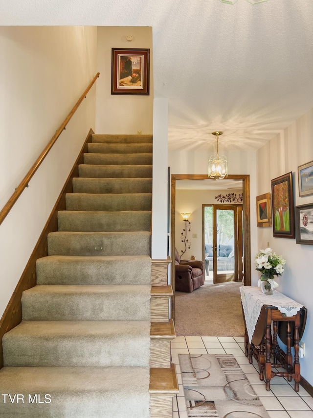 519 Foxgate Dr, Erwin, TN 37650 - stairs with tile patterned floors, a chandelier, and carpet