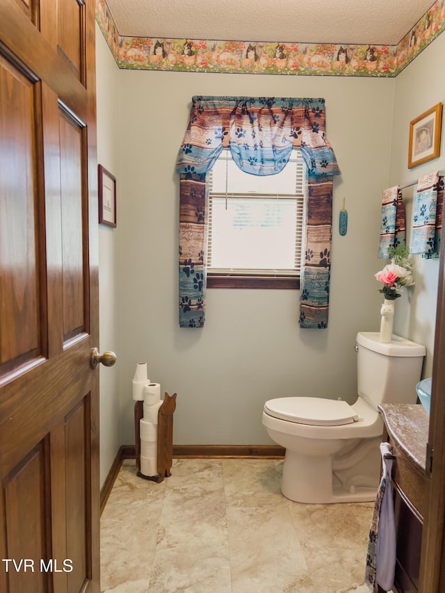 519 Foxgate Dr, Erwin, TN 37650 - half bathroom featuring toilet, vanity, and baseboards