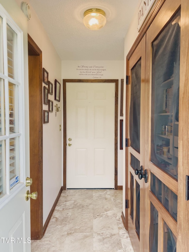 519 Foxgate Dr, Erwin, TN 37650 - doorway with baseboards and light marble finish floors