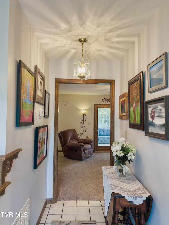 519 Foxgate Dr, Erwin, TN 37650 - hall with light carpet, light tile patterned flooring, and baseboards