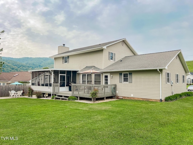 519 Foxgate Dr, Erwin, TN 37650 - back of house featuring a sunroom, a chimney, a deck with mountain view, and roof with shingles