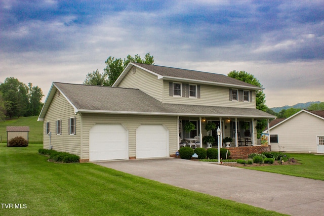 519 Foxgate Dr, Erwin, TN 37650 - view of front facade with a porch, a garage, asphalt driveway, a front yard, and a shingled roof