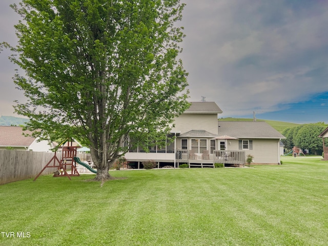 519 Foxgate Dr, Erwin, TN 37650 - rear view of property featuring a playground, a sunroom, a deck, and roof with shingles