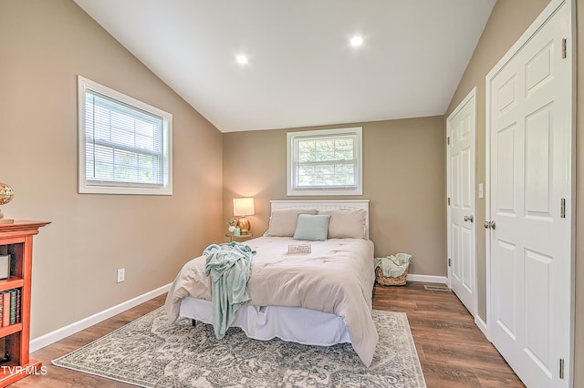 145 Elm Heights St, Johnson City, TN 37615 - bedroom with multiple windows, lofted ceiling, dark wood-type flooring, baseboards, and recessed lighting