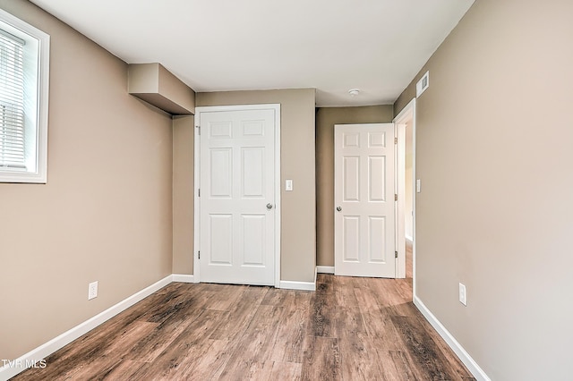 145 Elm Heights St, Johnson City, TN 37615 - unfurnished bedroom featuring wood finished floors and baseboards