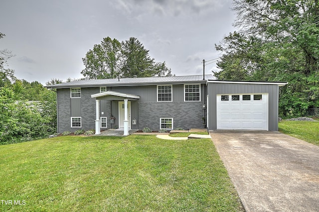 145 Elm Heights St, Johnson City, TN 37615 - split foyer home with driveway, a front lawn, an attached garage, and brick siding