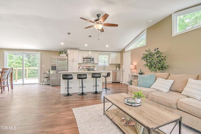 145 Elm Heights St, Johnson City, TN 37615 - living room featuring plenty of natural light, a ceiling fan, wood finished floors, lofted ceiling, and recessed lighting