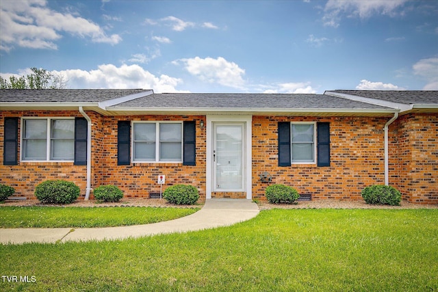 1544 Jessee St Unit Y, Kingsport, TN 37664 - view of front of home featuring brick siding, a front lawn, and roof with shingles