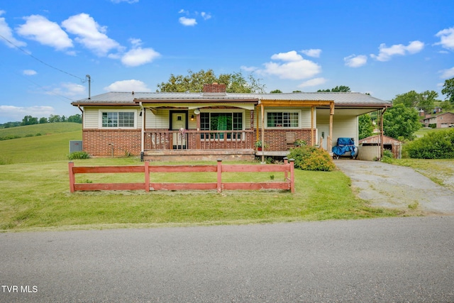 7175 Reedy Creek Rd, Bristol, VA 24202 - ranch-style house featuring covered porch, driveway, a chimney, a carport, and brick siding