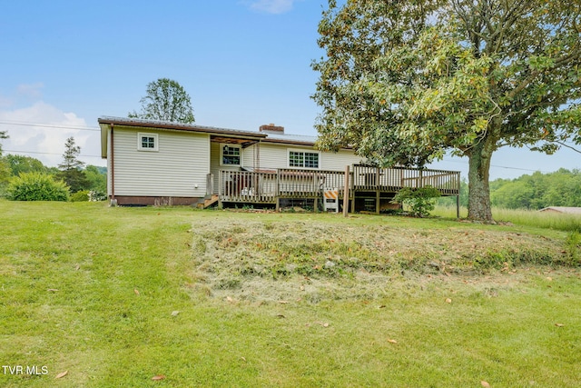 7175 Reedy Creek Rd, Bristol, VA 24202 - rear view of property with a wooden deck, a lawn, and a chimney