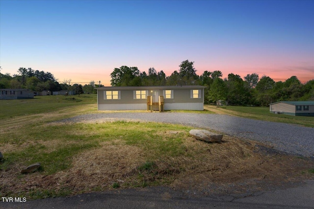 113 Hicks Dr, Johnson City, TN 37615 - manufactured / mobile home featuring gravel driveway and a lawn