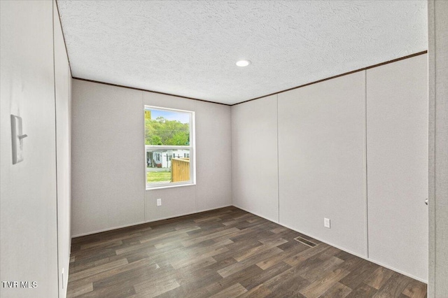 113 Hicks Dr, Johnson City, TN 37615 - unfurnished bedroom with wood finished floors, a textured ceiling, and recessed lighting