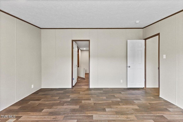 113 Hicks Dr, Johnson City, TN 37615 - spare room with ornamental molding, wood finished floors, a textured ceiling, and a decorative wall
