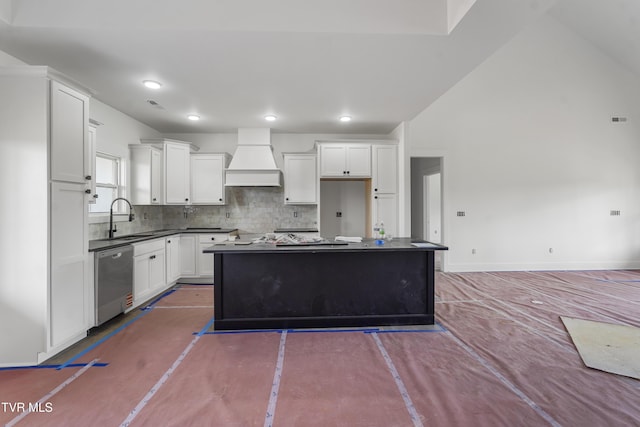 kitchen featuring stainless steel dishwasher, custom exhaust hood, a sink, a kitchen island, and backsplash