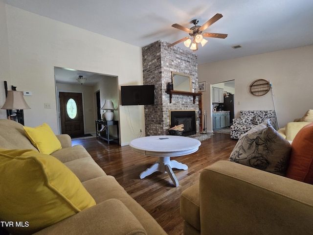 1382 Elijah Martin Rd, Whitesburg, TN 37891 - living area with wood finished floors, ceiling fan, and a fireplace