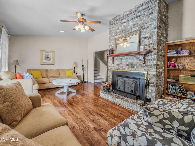 1382 Elijah Martin Rd, Whitesburg, TN 37891 - living area featuring a ceiling fan, wood finished floors, a brick fireplace, and stairway