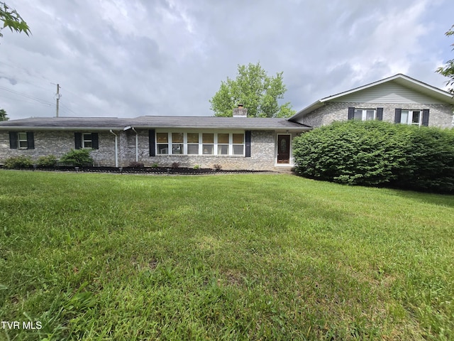 1382 Elijah Martin Rd, Whitesburg, TN 37891 - view of front of home featuring a chimney, a front yard, and brick siding