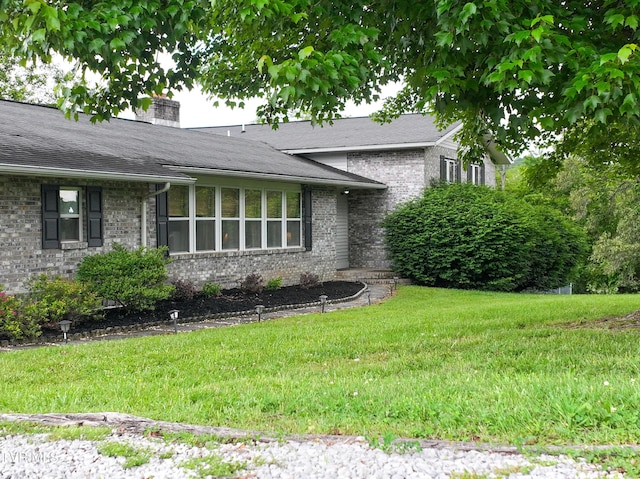 1382 Elijah Martin Rd, Whitesburg, TN 37891 - view of front of house with brick siding, a chimney, and a front lawn