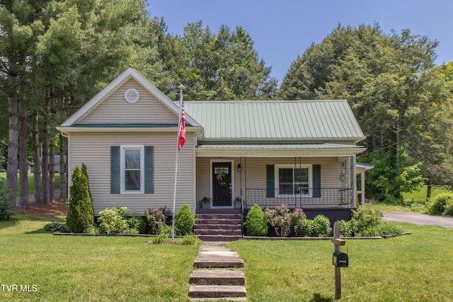 435 Sulpher Spring Rd, Chilhowie, VA 24319 - view of front of home with covered porch, a front lawn, and metal roof