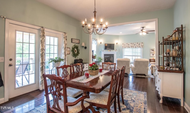 435 Sulpher Spring Rd, Chilhowie, VA 24319 - dining room featuring a fireplace, dark wood finished floors, ceiling fan, and baseboards