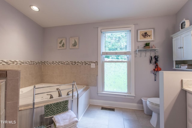 435 Sulpher Spring Rd, Chilhowie, VA 24319 - bathroom featuring plenty of natural light, toilet, a garden tub, tile patterned floors, and recessed lighting