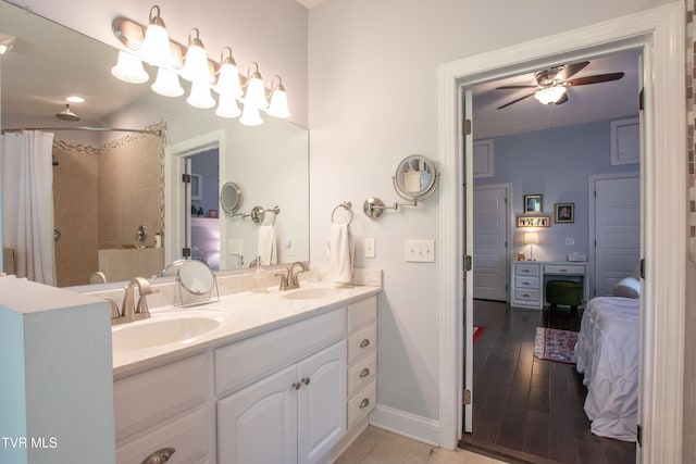 435 Sulpher Spring Rd, Chilhowie, VA 24319 - bathroom featuring double vanity, a ceiling fan, tiled shower, and baseboards
