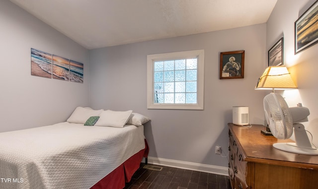 435 Sulpher Spring Rd, Chilhowie, VA 24319 - bedroom with baseboards and dark wood-style flooring