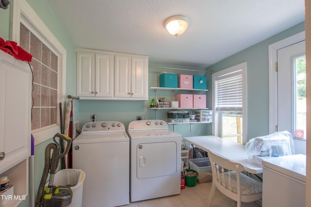 435 Sulpher Spring Rd, Chilhowie, VA 24319 - laundry area featuring independent washer and dryer, cabinet space, light tile patterned floors, and a textured ceiling
