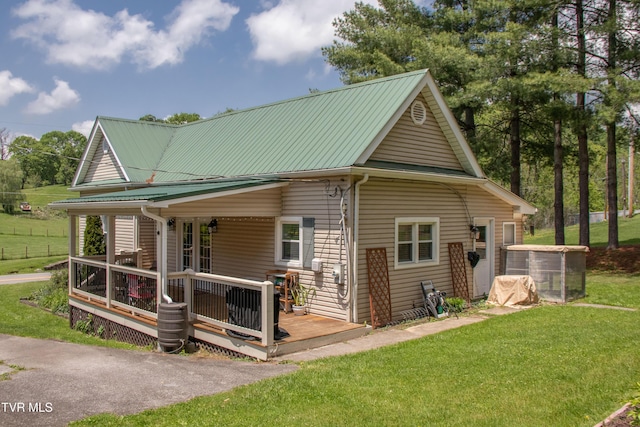 435 Sulpher Spring Rd, Chilhowie, VA 24319 - view of front facade featuring a front yard, a deck, and metal roof